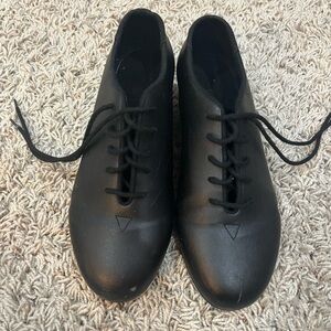 Black tap shoes. Worn one dance season.